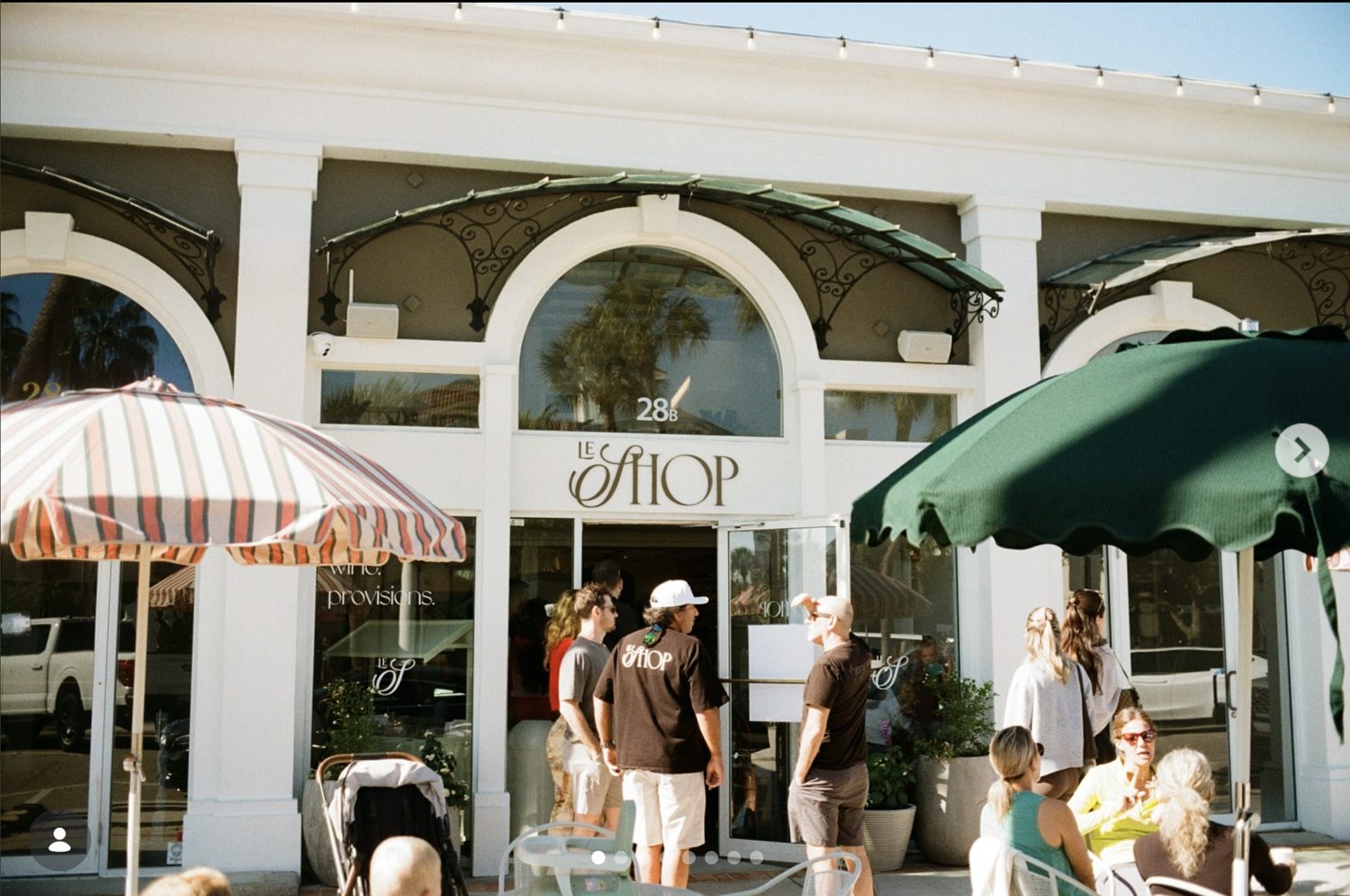 The Le Shop storefront on St. Armands Circle, with arched windows and café umbrellas