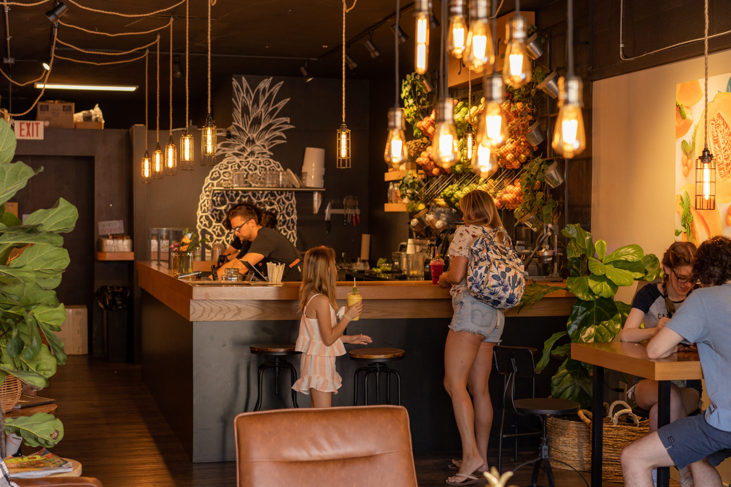 The pineapple-mural bar inside Summer Tap Juice Bar in Sarasota